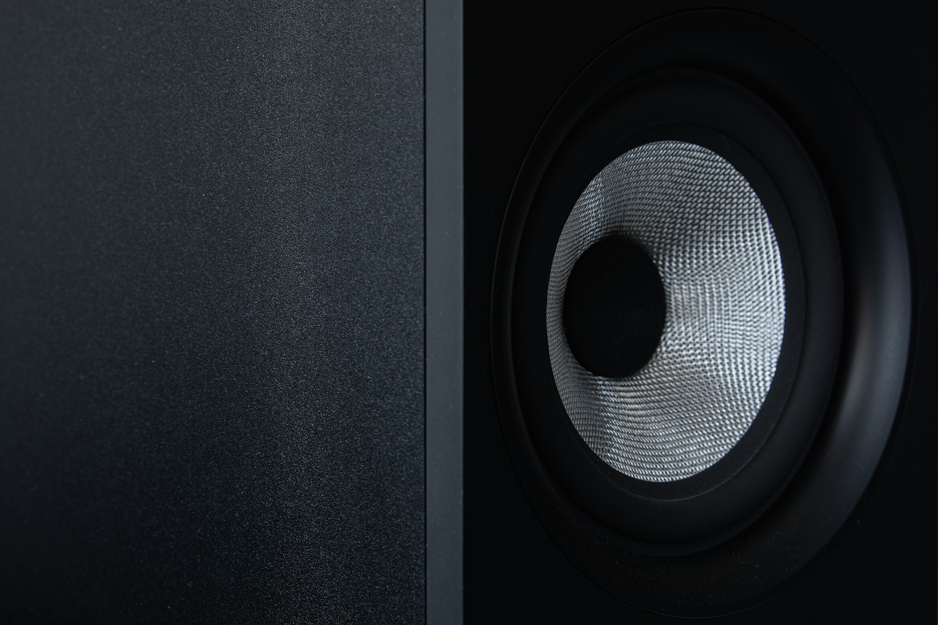 a close up of a speaker with a black background